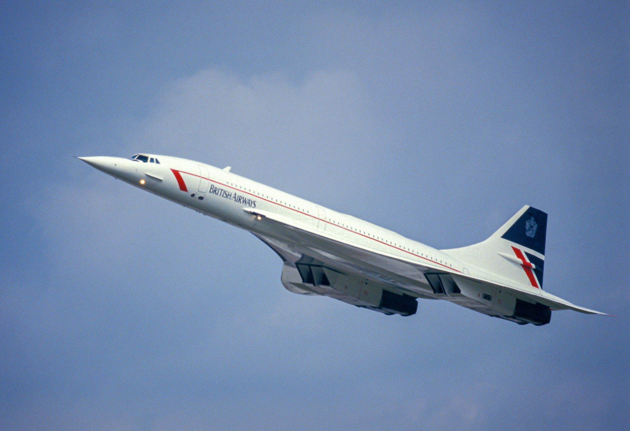 A British Airways Concorde on a climb in good weather.