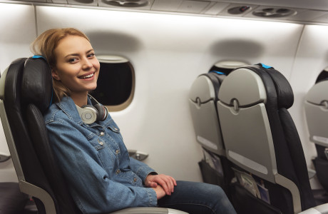 happy woman in the plane