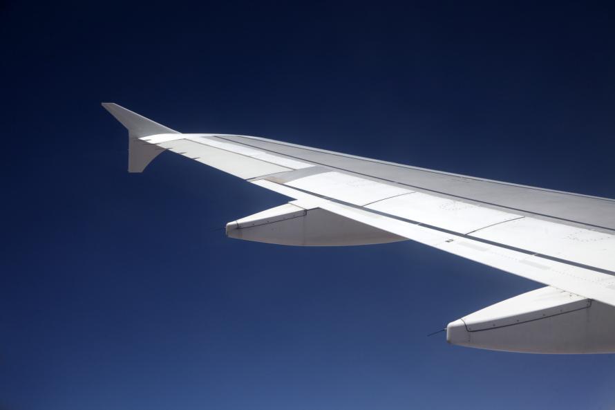 The wing of an airplane during flight.