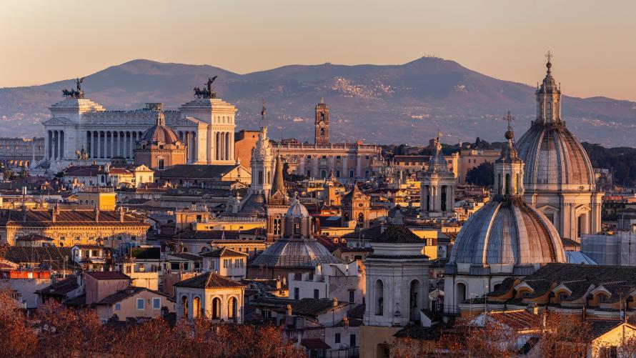 The skyline of Rome’s historic center during sunset.