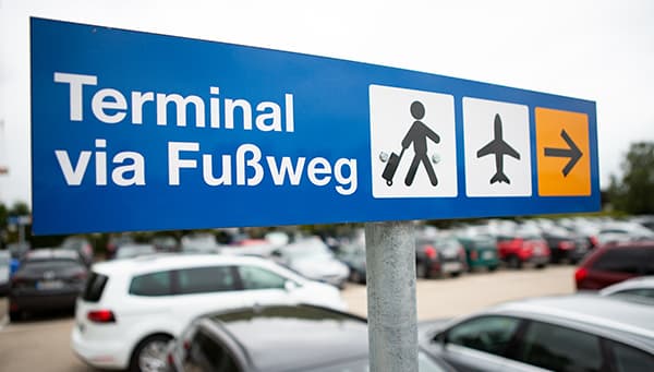 Directional signs to the airport terminal at Easy Airport Parking